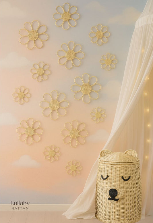 Decorative wall with yellow flower patterns and a wicker basket with a bear face design.