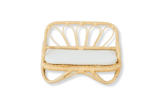 A boho montessori type doll bed made of rattan material. Ec0-friendly and a strong toy that will not break. 
