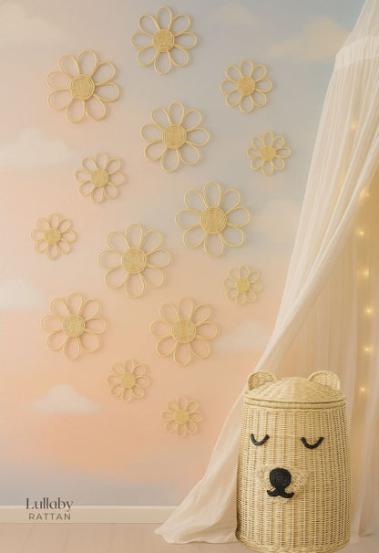 Decorative wall with yellow flower patterns and a wicker basket with a bear face design.
