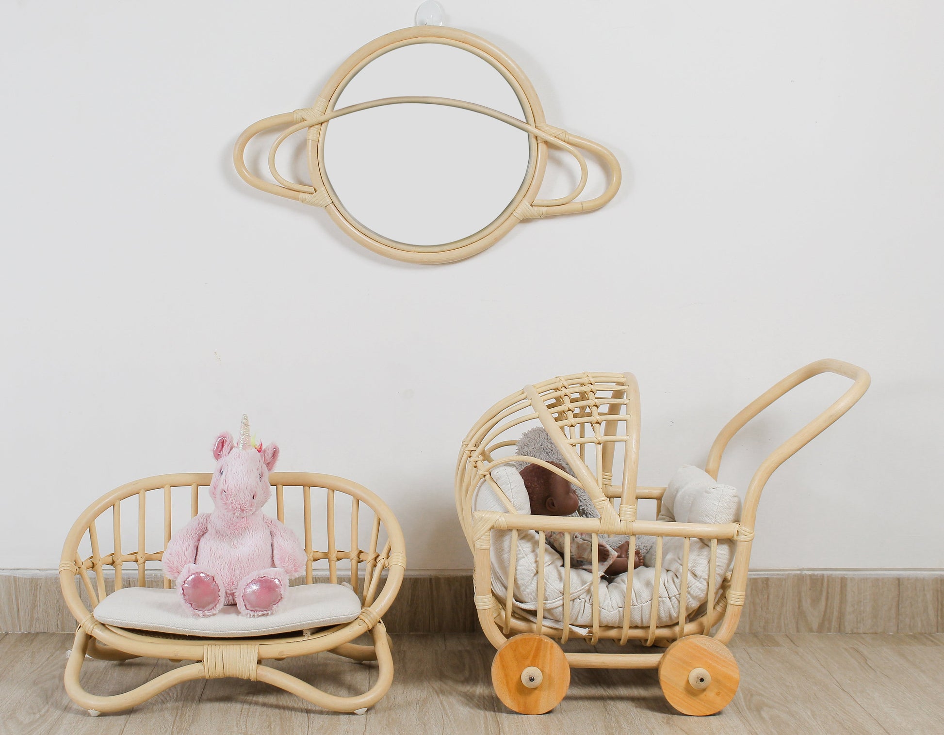 The cozy, intimate scene of the miniature rattan bench next to a girls doll pram makes it a charming and unique choice for Christmas gifts or a special stocking stuffers idea for a doll-loving child.