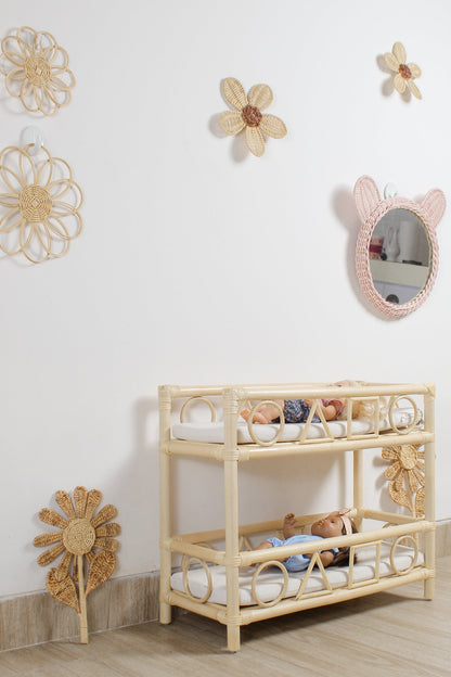 Natural rattan wildflower wall art used as nursery wall decor for a girl’s room