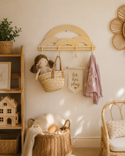 Nursery room with wicker cloud hook, basket, and child's doll.