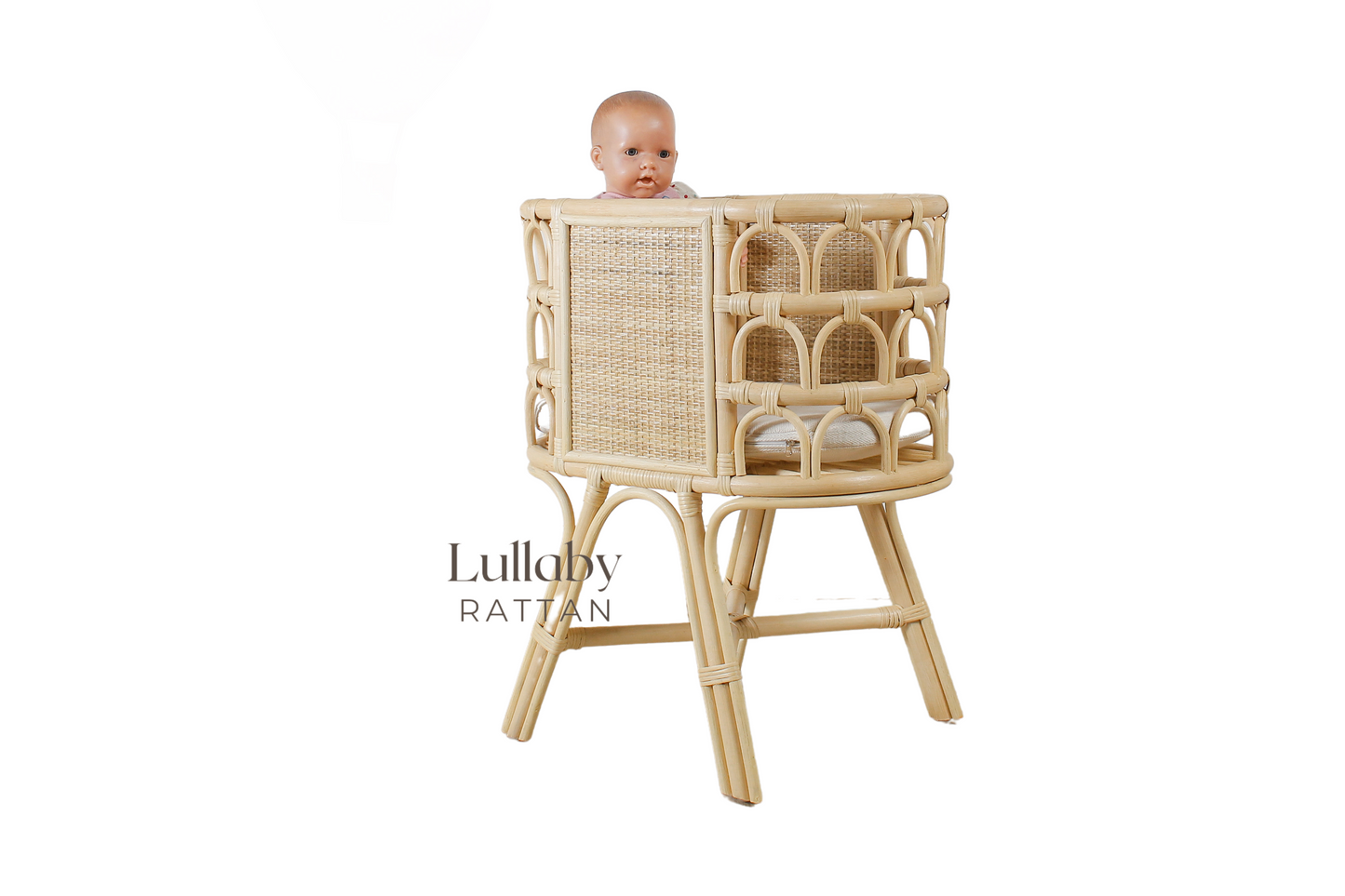 A doll sits in a doll sized crib or bassinet. It is a sturdy toy and good for strong toys. 