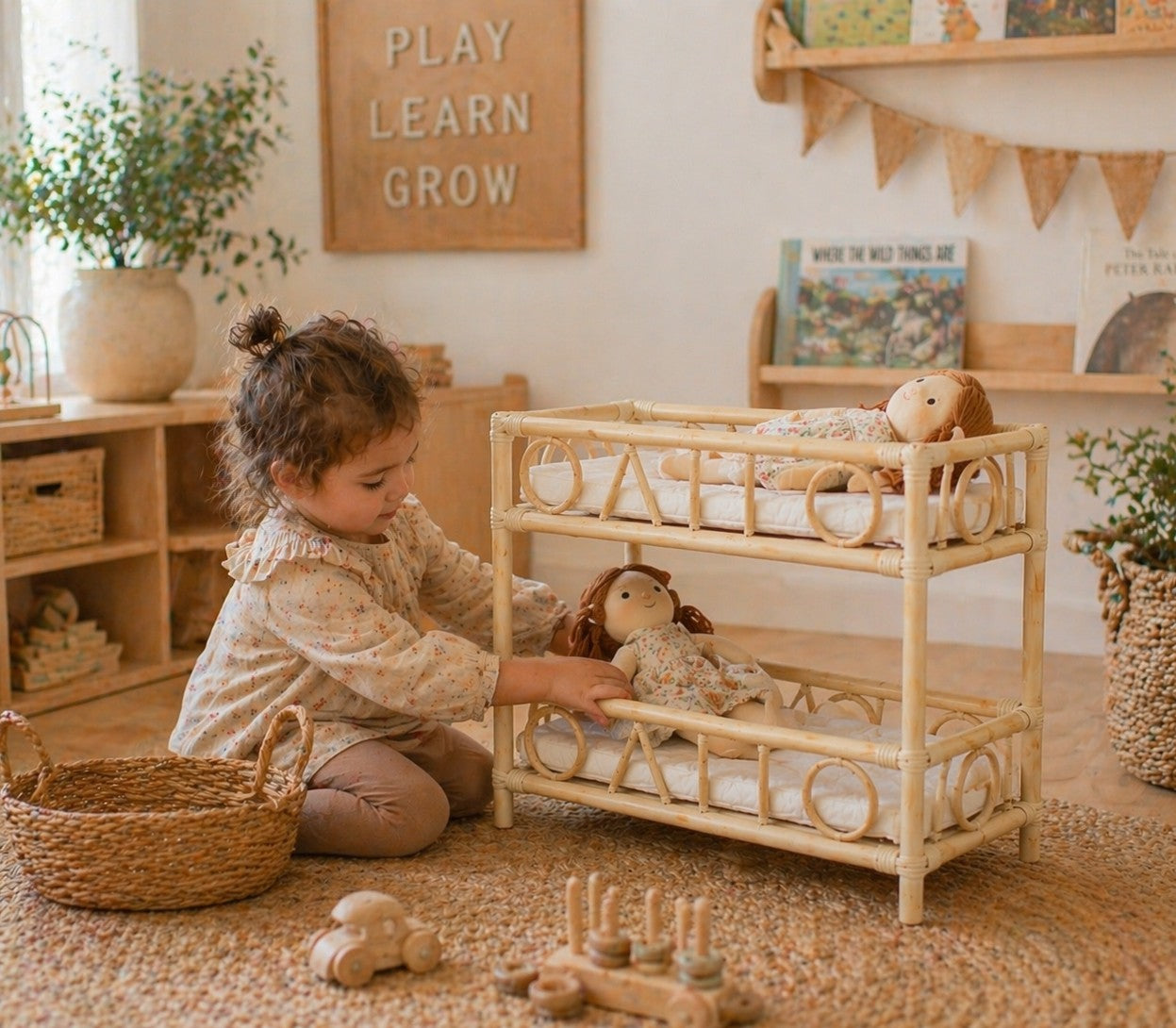 Child playing with a dollhouse in a cozy room with wooden furniture and plants.