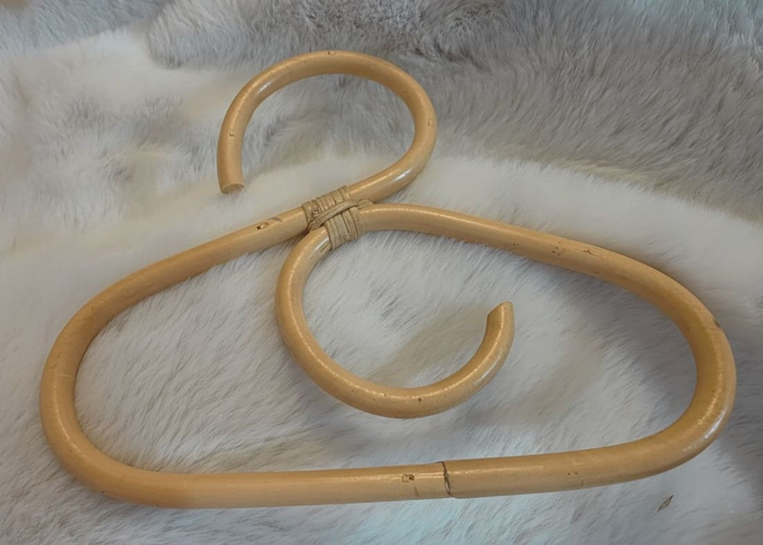 A rattan made dolls coat hanger