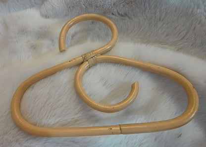 A rattan made dolls coat hanger