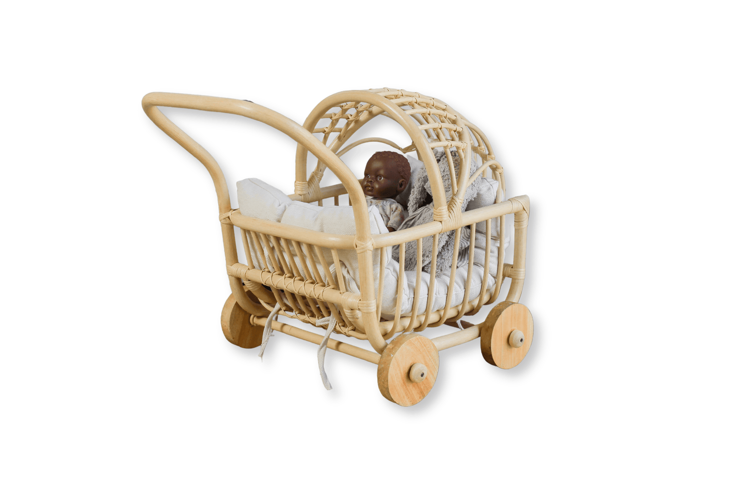 A baby doll sits in a doll stroller