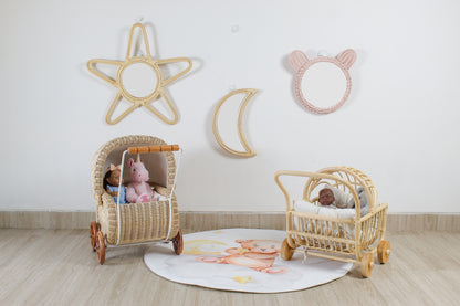 Children's room with decorative wall art and baby buggies on a wooden floor.