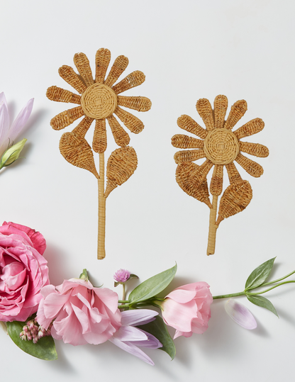 Two woven flower designs on a white background with pink and green flowers. Wall decoration or girls bedroom style