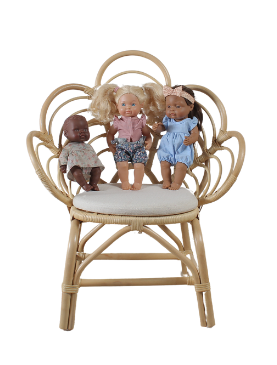 Three dolls sit on a wicker chair styled as a flower. A cushion is included.