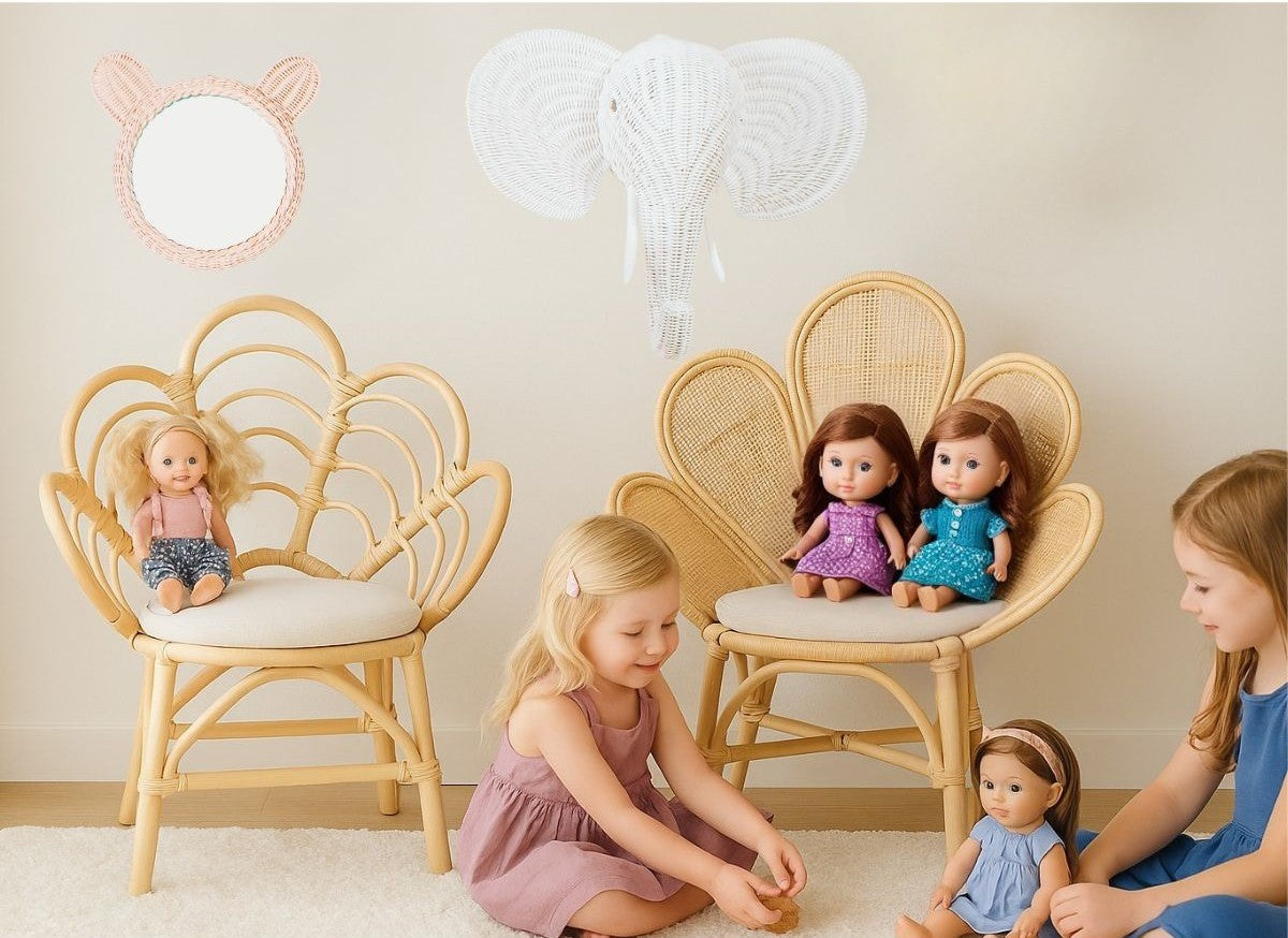 Children playing with dolls in a room with decorative chairs and a lamp.