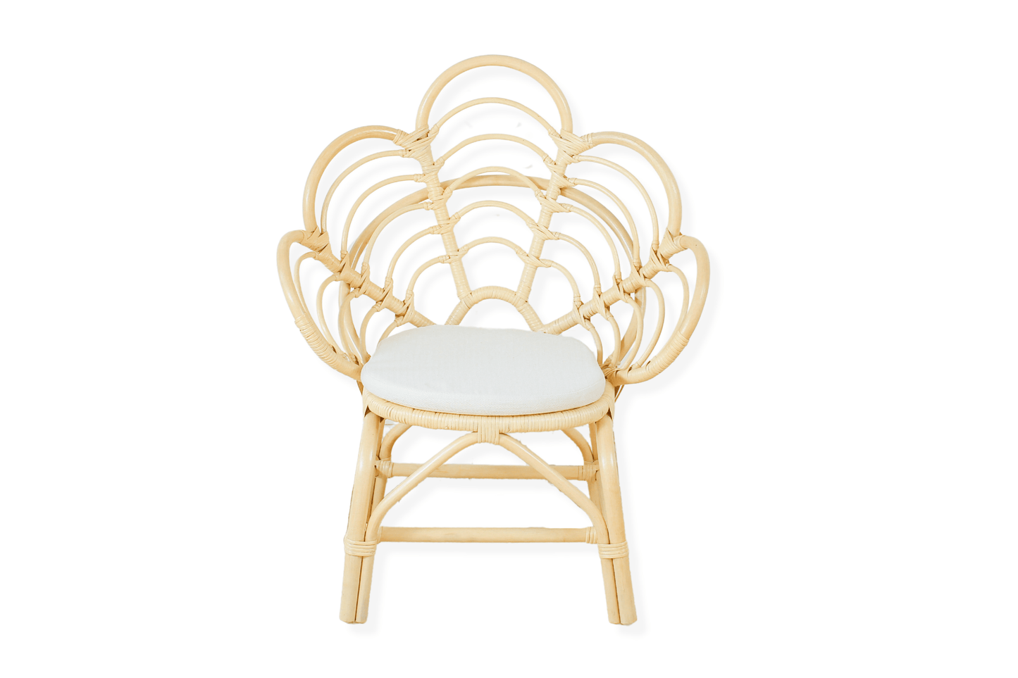 A decorative rattan chair with a petal pattern design, featuring a natural color finish and a white seat cushion.