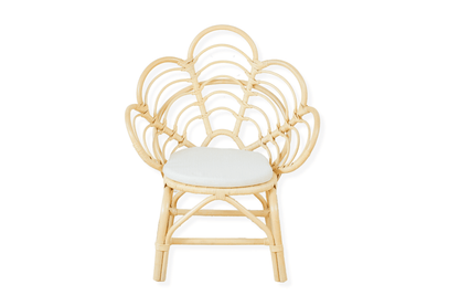 A decorative rattan chair with a petal pattern design, featuring a natural color finish and a white seat cushion.