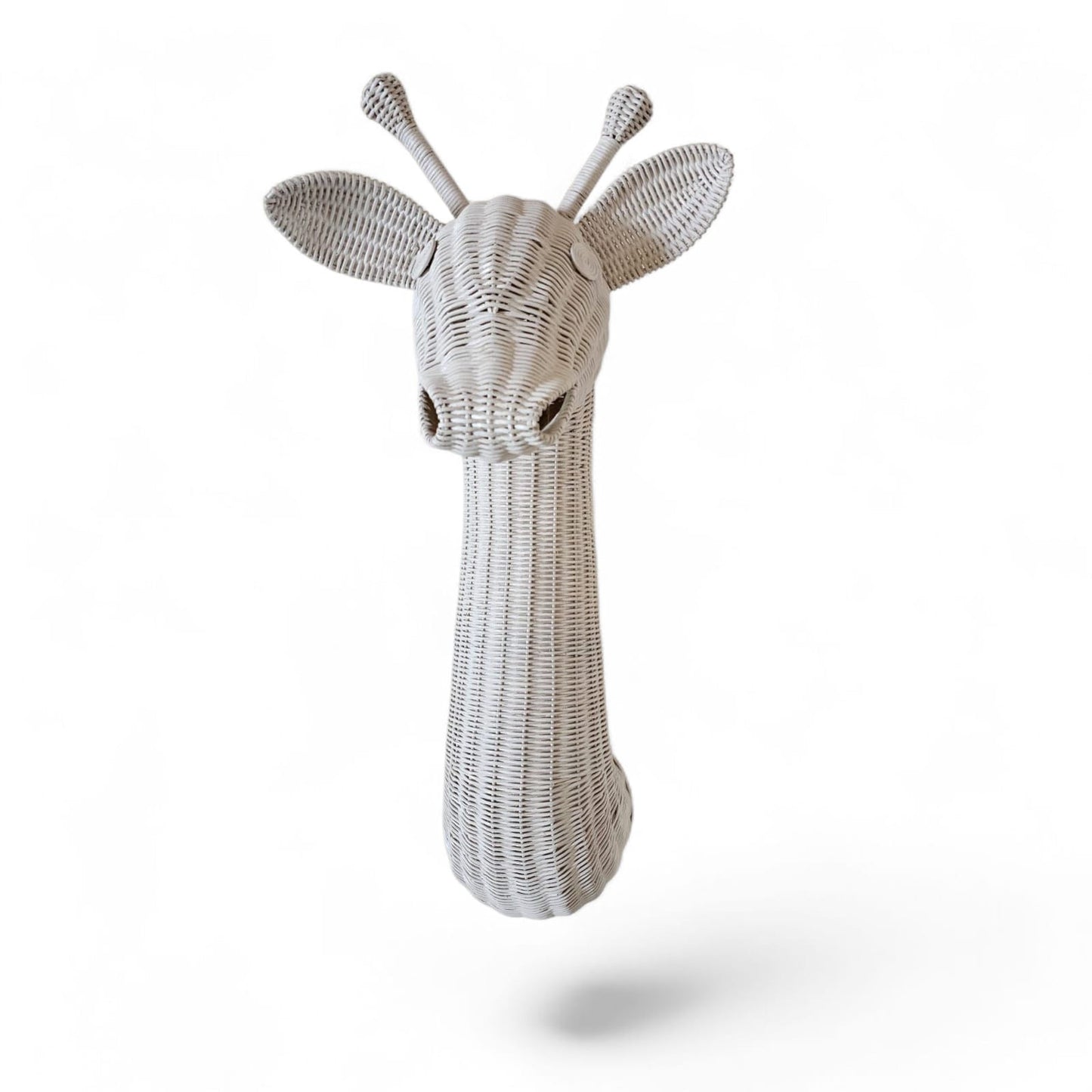 Decorative wicker giraffe head on a white background. Intricate weaving. Unique wall decor. 