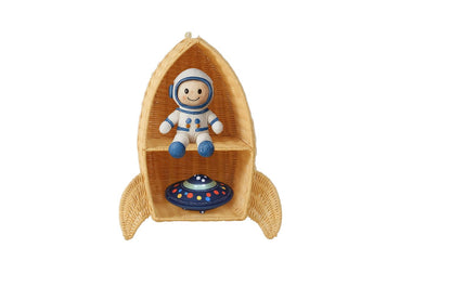 astronaut toy and flying saucer toy sitting on a kids rocket ship themed wall shelf