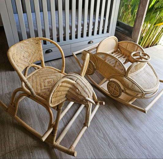 A toy kids rocking chair or car sits in a nursery