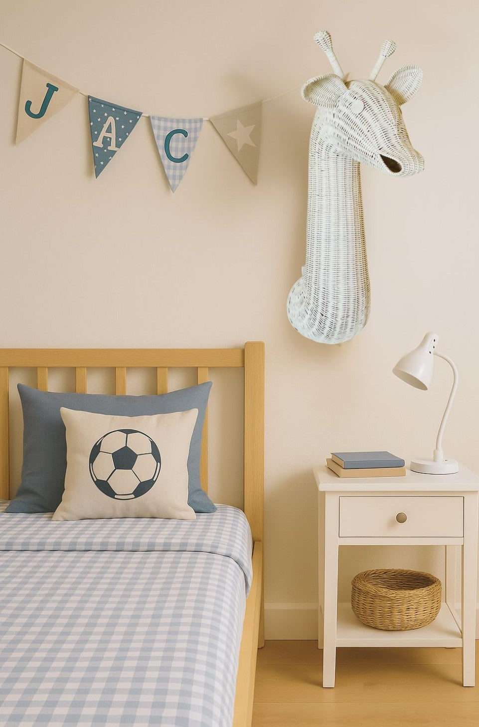 Children's bedroom with wooden bed, decorative pillows, and a giraffe head on the wall.
