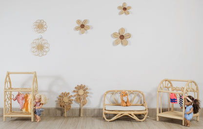 Children's room with wooden furniture and toys on a light wood floor.