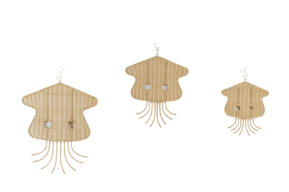 Rattan made jellyfish hanging on a white wall. Kids room design. 