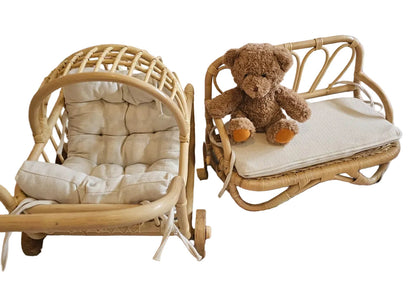 Children's room with wicker chairs and a teddy bear on a colorful rug.