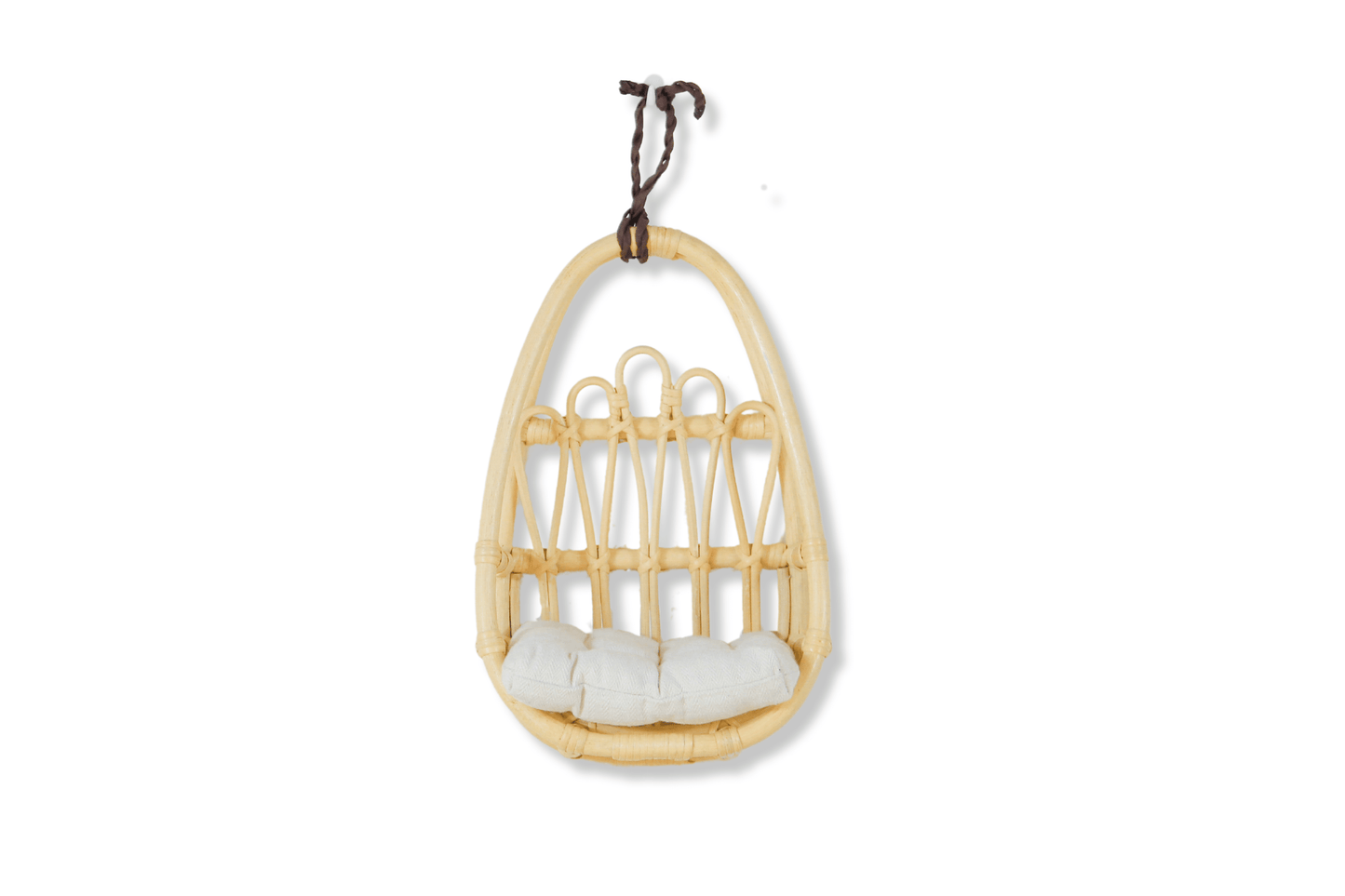 Beautiful rattan wall decor piece styled in a toddler girl’s boho bedroom with light earthy tones.