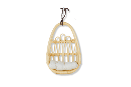 Beautiful rattan wall decor piece styled in a toddler girl’s boho bedroom with light earthy tones.