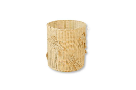 A dragonfly or butterfly inspired laundry hamper or toy storage basket to keep clothes, toys, blankets or tiny treasures. Made of 100% rattan, beige in color. 