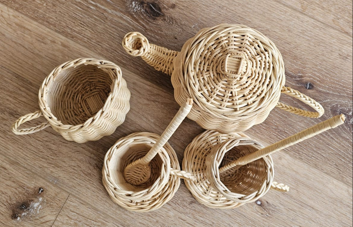 Flat lay of handmade wicker tea set for kids playroom decor