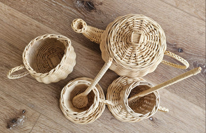 Flat lay of handmade wicker tea set for kids playroom decor