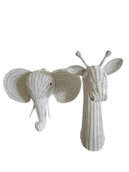 Woven elephant and giraffe heads on a white background. Wicker wall art. Rattan made white elephant head and giraffe head