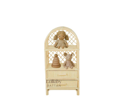 Wicker shelf with two plush toys and wooden building blocks with a doll. Kids toy room inspiration and boho style
